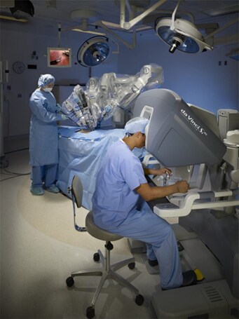 Doctor performs robotic surgery