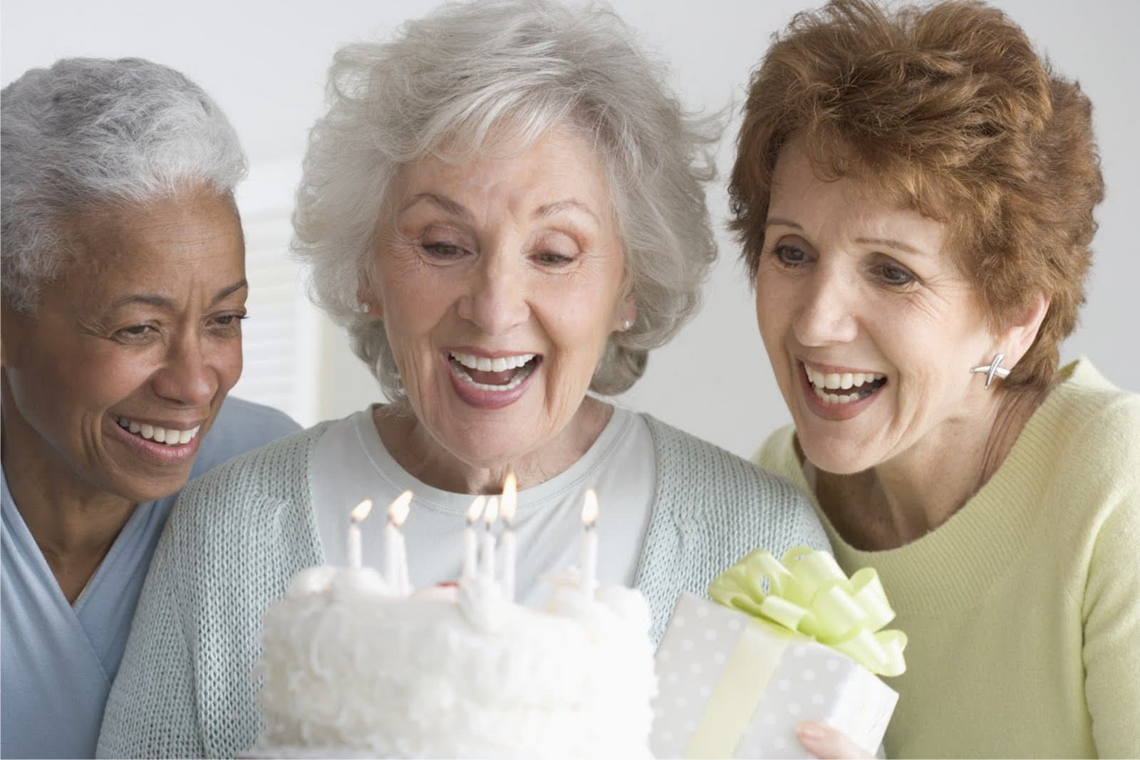 Three seniors and cake