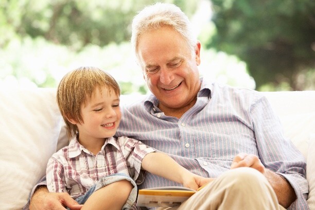 Older Man and boy reading