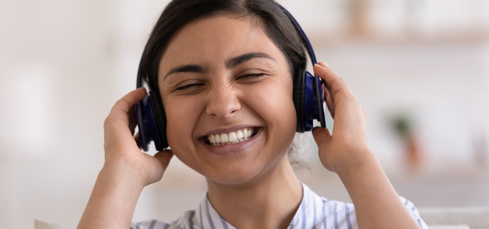 woman smiling on headphones